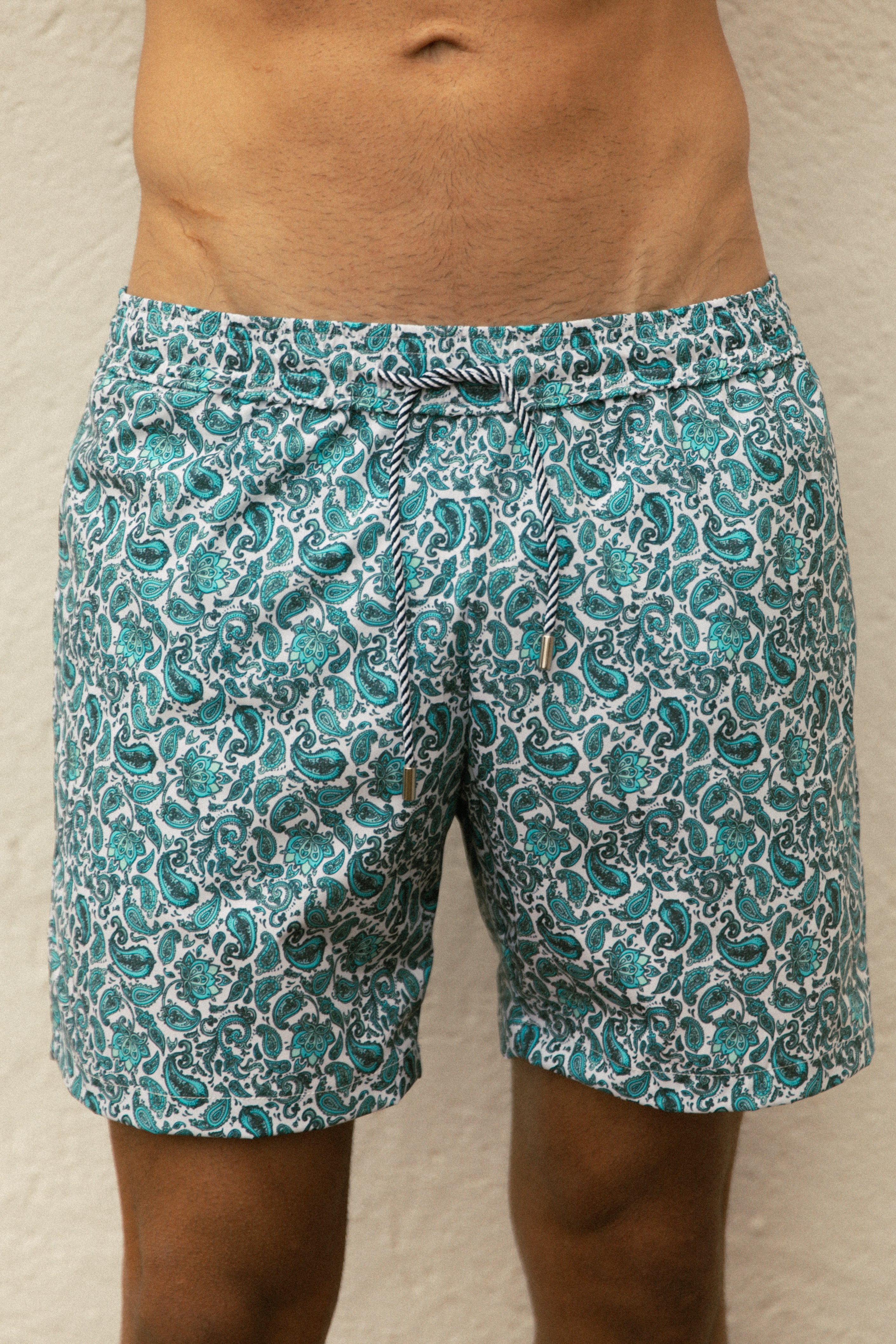 Slim model wearing printed blue swimsuit AQVA Swimwear